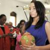 Gladstone Taylor/Photographer

Robyn Brown carries the cremated remains of her father,  Professor Aggrey Brown, during the service of thanksgiving held at the University Chapel in St Andrew yesterday.