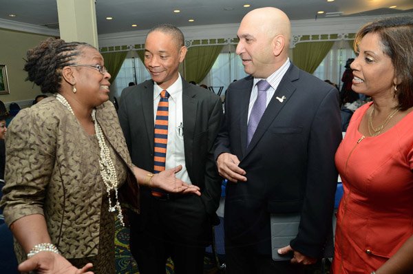 Rudolph Brown/Photographer
Business Desk
Guest speaker Dr. Claire Nelson, (left) President of Institute of Caribbean Studies Chat with from right Bernadette Barrow, assistant general manager, Small and Medium Enterprise, retail banking division, NCB, Christopher Zacca, president of the Private Sector Organisation of Jamaica, (PSOJ)  and Dennis Chung at the PSOJ Chairman Club Forum breakfast meeting at Knutsford Court Hotel in Kingston on Tuesday, May 28, 2013