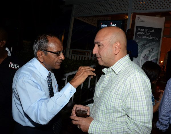 Winston Sill/freelance Photographer
BUSINESS DESK:-----The Private Sector Organisation of Jamaica (PSOJ) host Members Mingle, held at the British High Commission, Trafalgar Road on Wednesday night November 5, 2014. Here are Sushil Jain? (left); and Christopher Zacca (right), President, PSOJ.