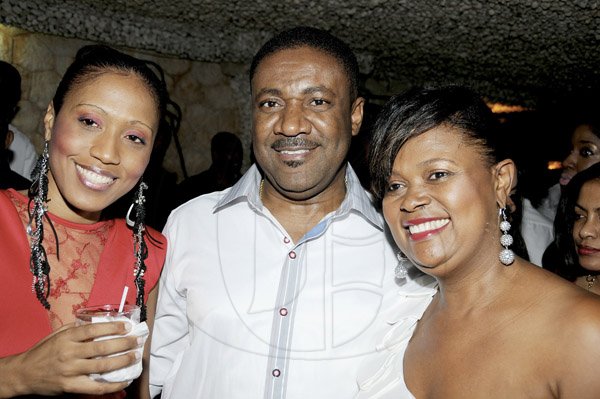 Winston Sill / Freelance Photographer
Pulse International Limited annual Christmas Eve Party, held at Villa Ronai, Old Stony Hill Road on Monday night December 24, 2012. Here are Denise Walfall (left); Minister Phillip Paulwell (centre); and Dollis Campbell (right).