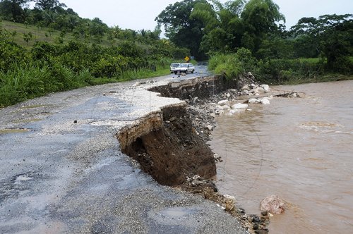 Ian Allen/Photographer
Section of the Dover Castle main road in St.Catherine that was washed away last night.