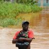 Ricardo Makyn/Staff Photographer
Alfredo Thomas wades through High Waters as He recovers clothing from His House,Houses under Water in the Osbourne Store Community just outside of May Pen Clarendon due to the continuous  Rainfall for the past week.