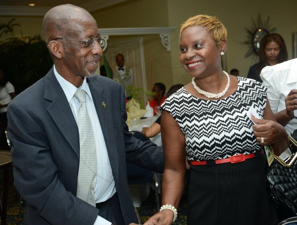Rudolph Brown/Photographer
Ambassador Burchell Whiteman chat with Jacinth Hall Tracey, General Manager, Lasco Financial Services at the Releaf Environmental Awareness Programme,(REAP) awards ceremony at the Knutsford Court Hotel on Tuesday, May 14, 2013