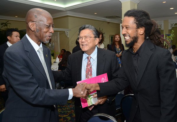 Rudolph Brown/Photographer
Ambassador Burchell Whiteman, (left) greets Lascelles Chin, (centre) Chairman and CEO of LASCO and Stephen Newland, REAP Programme Director at the Releaf Environmental Awareness Programme,(REAP) awards ceremony at the Knutsford Court Hotel on Tuesday, May 14, 2013
