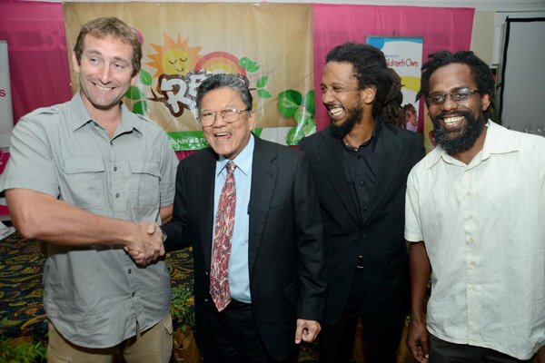 Rudolph Brown/Photographer
Lascelles Chin, (second left) Chairman and CEO of LASCO chat with from left Andrew Rose, UWI-CMS Marine Biologist Seascape Caribbean, Stephen Newland, REAP Programme Director and Dr. Kwame Emmanuel, Environmentalist at the Releaf Environmental Awareness Programme,(REAP) awards ceremony at the Knutsford Court Hotel on Tuesday, May 14, 2013
