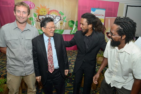 Rudolph Brown/Photographer
Lascelles Chin, (second left) Chairman and CEO of LASCO chat with from left Andrew Rose, UWI-CMS Marine Biologist Seascape Caribbean, Stephen Newland, REAP Programme Director and Dr. Kwame Emmanuel, Environmentalist at the Releaf Environmental Awareness Programme,(REAP) awards ceremony at the Knutsford Court Hotel on Tuesday, May 14, 2013