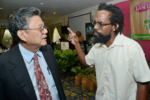 Rudolph Brown/Photographer
Lascelles Chin, (left) Chairman and CEO of LASCO chat with Dr. Kwame Emmanuel, Environmentalist at the Releaf Environmental Awareness Programme,(REAP) awards ceremony at the Knutsford Court Hotel on Tuesday, May 14, 2013