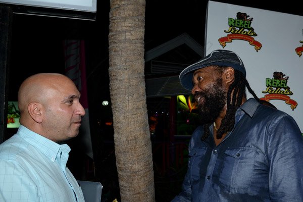 Winston Sill/Freelance Photographer
The Organic HEART Group of Companies presemnts Rebel Salute 2014  Launch, held at Countryside, Courtney Walsh Drive on Thursday night December 19, 2013. Here are Chris Zacca, President, PSOJ; and Tony Rebel (right).