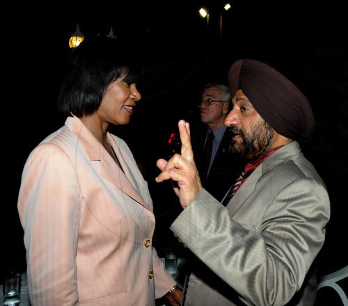 Winston Sill / Freelance Photographer
Indian High Commissioner Mohinder Grover is in deep conversation with Prime Minister Portia Simpson Miller.

The High Commissioner of India Mohinder Grover and wife Vardeep Grover host reception on the occasion of the 63rd Republic Day of India, held at India House, East Kings House Road on Thursday January 26, 2012.