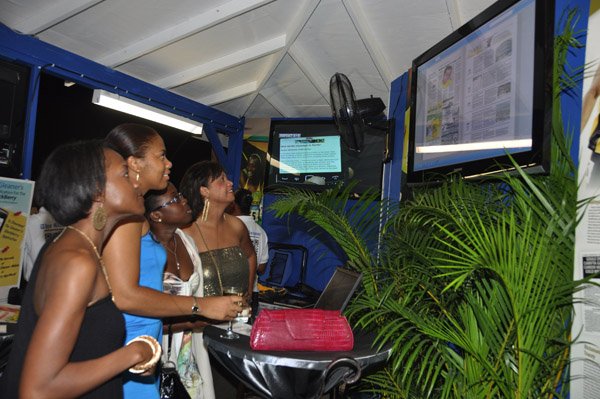 Janet Silvera Photo

Reggae Sumfest patrons immersed in The Gleaner's E-paper from L- Stacey Walker, Shaunette Swaby,-McDonald, Jhanelle Wagstaffe and Alison Higgins at the festival now on at the Catherine Hall Complex in Montego Bay
