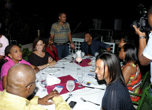 Winston Sill / Freelance Photographer

Eagerly awaiting the main course at the Grog Shoppe. Christopher Barnes, managing director The Gleaner Company (standing) chats with Bambino Restaurant Week ambassador (to his left) while others at the table enjoy each others' company. From front (left) Gary Cole director of marketing RJR Group, Yvonne Wilks director of commercial and corporate RJR Group, Stephanie Scott Restaurant Week conceptualizer, Andrea Messam director of finance RJR Group, Shauna-Gaye Hart (partially hidden) Annette Atkinson manager marketing RBC and Anika Smith corporate Communications manager RJR Group.    
*********************
Restaurant Week dining out feature with RBC Bank and guests at Cuddyz, New Kingston; Grog Shoppe, Devon House; and Guilt Trip, Barbican on Thursday night November 15, 2012.