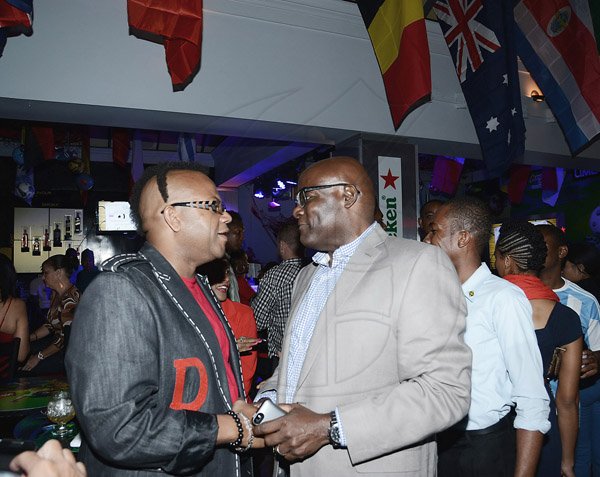 Winston Sill/Freelance Photographer
Ribbiz Ultra Lounge host the Grand Unveiling of World Cup Viewing Party, held at Batbican Centre, East King's House Road on Wednesday night June 11, 2014.  Here are Don Creary (left); and Brian George (right).