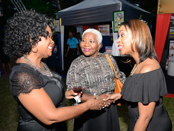 Jermaine Barnaby/ Freelance PhotographerBrenda Weathers (right) talking with Dollis Campbell (left) and Marilyn Bennett at the RJRGLEANER CLIENT APPRECIATION AWARDS at the Sunken Gardens at Hope Botanical Gardens on Thursday, June 22, 2017.