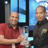 Jermaine Barnaby/ Freelance Photographer<\n>Major Hugh Blake (right) collects the top spending advertiser award for Power 106 from Colin Hines at the RJRGLEANER CLIENT APPRECIATION AWARDS at the Sunken Gardens at Hope Botanical Gardens on Thursday, June 22, 2017. *** Local Caption *** @Normal:Major Hugh Blake (right) from Jamaica Cane Products Sales Ltd collects the Top Spending Advertiser Award for Power 106 and Music 99 FM from Colin Hines.