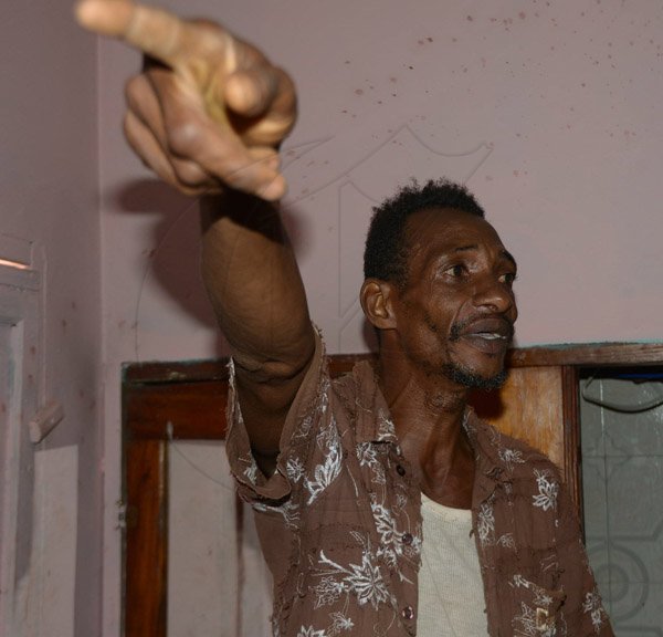 Ian Allen/Staff Photographer
Resident of a house in Rose Hall District, St.Elizabeth pleading for help to rid them of a Duppy that has been terrorizing them for weeks.