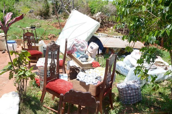 Ian Allen/Staff Photographer
Damaged furniture outside the house

Furnitures that was damaged by Duppy in a house in Rose Hall District, St.Elizabeth.
