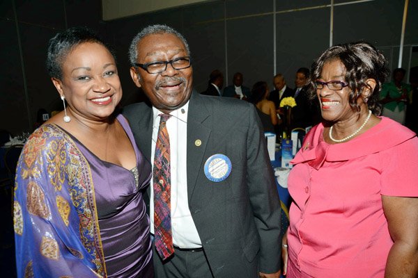 Rudolph Brown/ Photographer
Dr. Lloyd Ebanks-Green chat with Scarlett Gillings, (right) and Minna Israel at the Rotary Club of St. Andrew  Installation banquet at the Jamaica Pegasus Hotel in New Kingston on Tuesday, July 9, 2013.