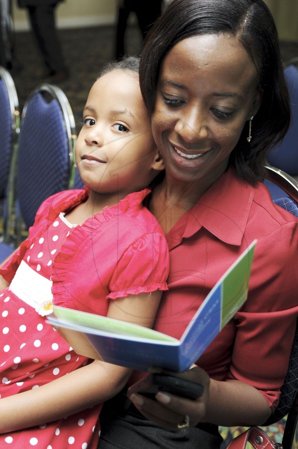 Ricardo Makyn/Staff Photographer
  Suzette Rogers with Daughter Maia Simone-Rogers at the Sagicor annual GSAT awards ceremony at the Knutsford Court Hotel on Thursday 23.8.2012