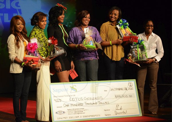 Rudolph Brown/Photographer
The winning model Camiella Davis, (third left) pose with her team members from left Kelly-Ann Campbell, Natalie Lumsden,  Stacy-Ann Wilson, Trishana Jackson, Marsha Rae McBean at the Sagicor Stars week Design Spotlight competition at the Little Theater in Kingston on Tuesday, December 4, 2012