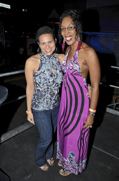 Rudolph Brown/Photographer
Tanya Miller, (left) and Suzette Shaw Reid are all smiles at the Sagicor Christmas party at the office's car park in New Kingston on Saturday.




, December 3-2011