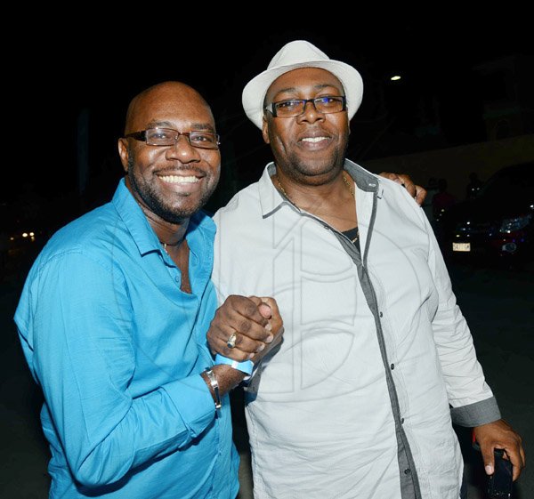 Rudolph Brown/Photographer
Karl Williams, Vice President Group Human Resources at Sagicor greets Loven McCook at the Sagicor Christmas party at the Famous Night Club, in Portmore on Saturday, December 7, 2013