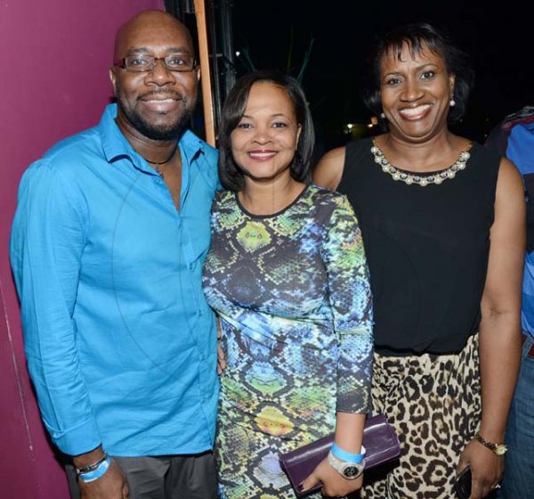 Rudolph Brown/Photographer
Karl Williams, Vice President Group Human Resources at Sagicor pose with Tamara Waul Douglas, (centre) and Annmarie Smith at the Sagicor Christmas party at the Famous Night Club, in Portmore on Saturday, December 7, 2013