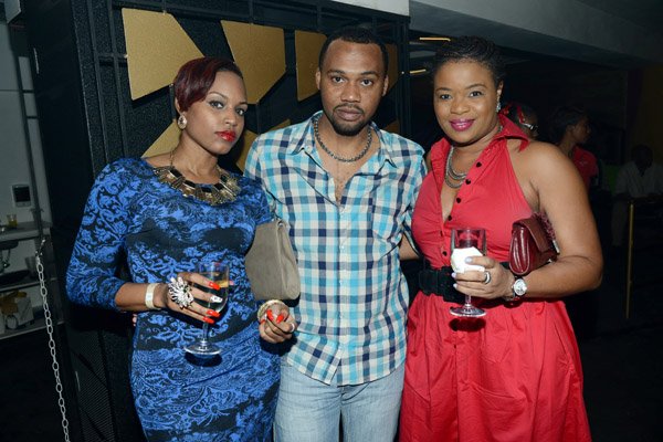Rudolph Brown/Photographer
Rayon Parchment pose with Sharona James, (left) and Leslie Ferguson at the Sagicor Christmas party at the Famous Night Club, in Portmore on Saturday, December 7, 2013