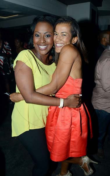 Rudolph Brown/Photographer
Alysia Moulton-White greets Amelia 'Milk' Sewell, at the Sagicor Christmas party at the Famous Night Club, in Portmore on Saturday, December 7, 2013