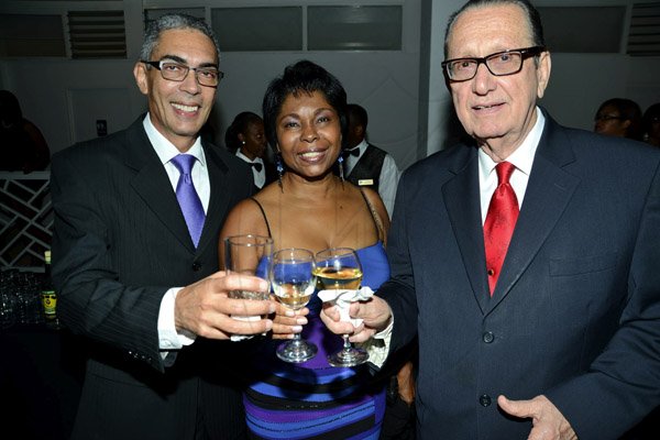 Rudolph Brown/Photographer
Richard Byles and wife Jacinth cheers to R. Danny Williams (right) Chairman of Sagicor at Sagicor Jamaica Group 42 Annual Corporate Awards at the Jamaica Pegasus Hotel on Wednesday, March 20, 2013