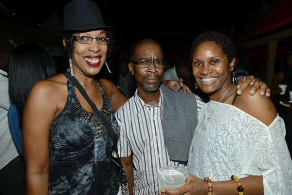 Rudolph Brown/Photographer
Willard Brown, Vice President Risk Management , Actuary of Sagicor pose with Kristine Bolt, (right) and Suzette Shaw Reid at the Sagicor memba dis Christmas party at the office car park in New Kingston on Saturday, December 8-2012