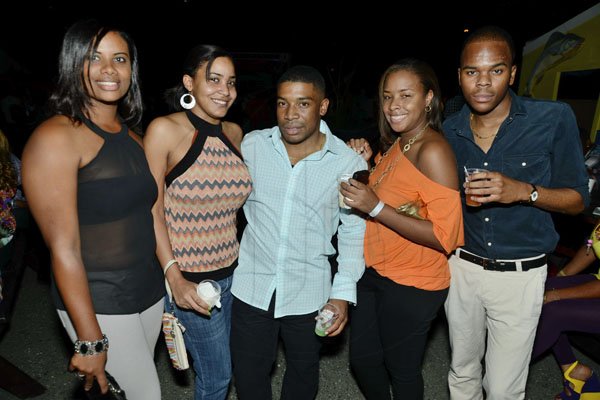 Rudolph Brown/Photographer
From left are Melissa Alen, Renee Graham, Jared Jackson, Terese Henry and Emile Waddell at the Sagicor memba dis Christmas party at the office car park in New Kingston on Saturday, December 8-2012