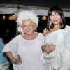 Ashley AnguinEvita's  Eva Myers (left) and Michelle Bovell, sticking to the all white dress code like at pro at Sans Souci Enchanted themed anniversary party.
