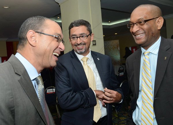 Rudolph Brown/Photographer
Don Wehby,(left) CEO of GraceKennedy share joke with Craig Mair, (centre) VP in corporate and commercial banking and Lissant Mitchell, CEO Scotia Investments at the Scotiabank Cocktails and Conversations panel discussion at the Knutsford Court Hotel in New Kingston on Wednesday, May 15, 2013