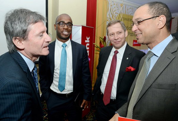 Rudolph Brown/Photographer
Don Wehby,(right) CEO of GraceKennedy in discussion with from left Pablo Breard, VP, Head of International Research, Scotiabank Group, Dr. Adrian Stokes and Bruce Bowen, (left) President of CEO, Scotiabank at the Scotiabank Cocktails and Conversations panel discussion at the Knutsford Court Hotel in New Kingston on Wednesday, May 15, 2013
