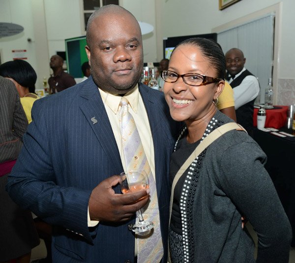 Rudolph Brown/Photographer
Fitzaudy Wright, Branch Manager pose with Marsha Williams at the Ocho Rios branch Scotia Insurance 15th Anniversary cocktail forum on Tuesday, September 24, 2013