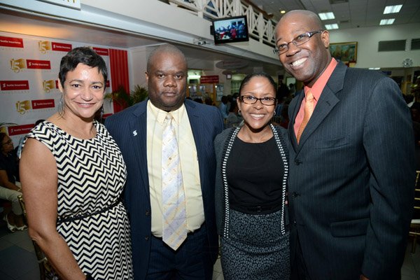 Rudolph Brown/Photographer
Hugh Reid, (right) President of Scotia Life Insurance pose with from left Denise Henry James. Attorney at law, Fitzaudy Wright, Branch Manager and Marsha Williams at the Ocho Rios branch Scotia Insurance 15th Anniversary cocktail forum on Tuesday, September 24, 2013