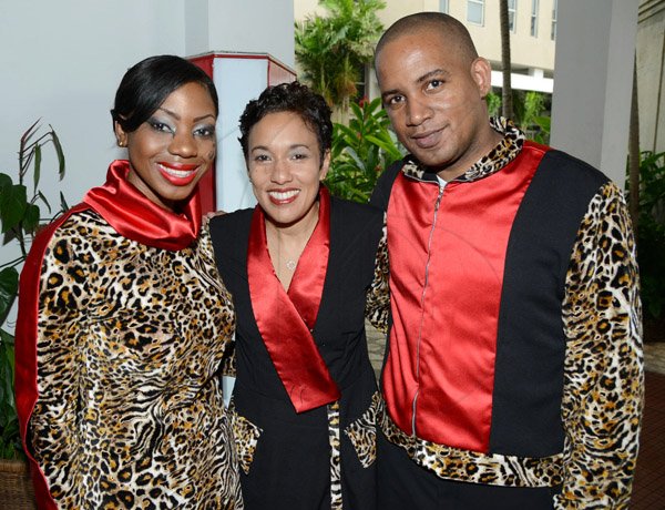 Rudolph Brown/Photographer
Jacqueline Sharp, (centre) President and CEO Scotiabank Group pose with Deidrean Williams and Julian Chin at the Scotiabank Sales Conference 2014 awards "We Dominated We Conquered Now hear us ROAR" at the Jamaica Conference Centre on Saturday January 25,2014