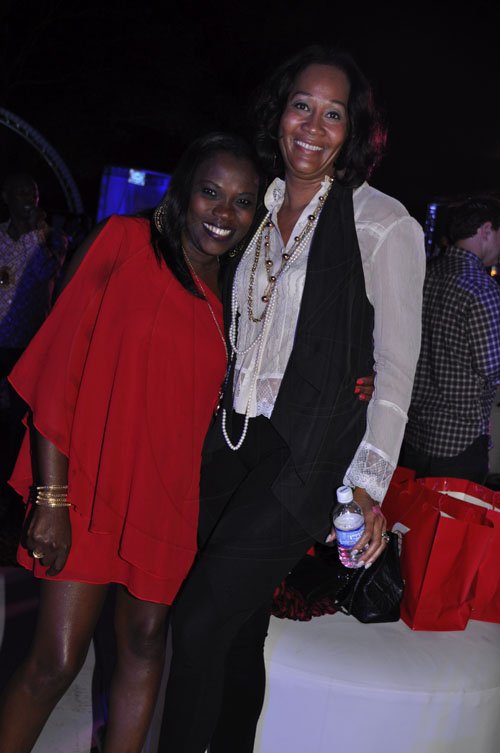 Janet Silvera Photo
 
Sandra Golding (left), looks like she is still celebrating husband Mark Golding's party's win in the recent general elections. Here she parties with Tracey-Ann Sinclair, wife of LIME's head honcho Garry Sinclair at Shaggy and Friends at Kings House, Kingston  last Saturday night.
