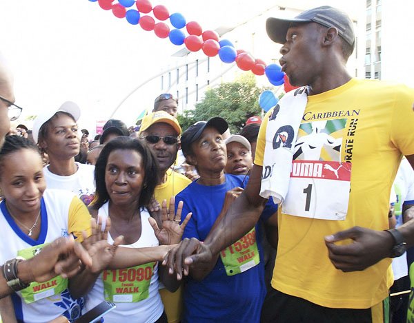Colin Hamilton Photographer
Usain Bolt with fans at the Sigma Run on Sunday 19.2.2012