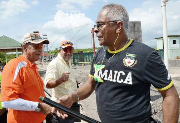 Rudolph Brown/Photographer
Evan Thwaites, (left) chat with Michael Banbury, (right) and Tommy Smith at Bernard Cridland Memorial Sporting Clay Shooting competition at the Jamaica Skeet Club on Sunday, October 27, 2013