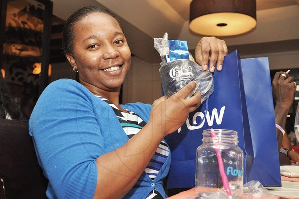 Jermaine Barnaby/Photographer
Shelleha Christie Allied Insurance Brokers claims agent was one of the first guest to win a goodie bag at RW Something Blue Challenge at Caffe Da Vinci on Monday, November 17, 2014.