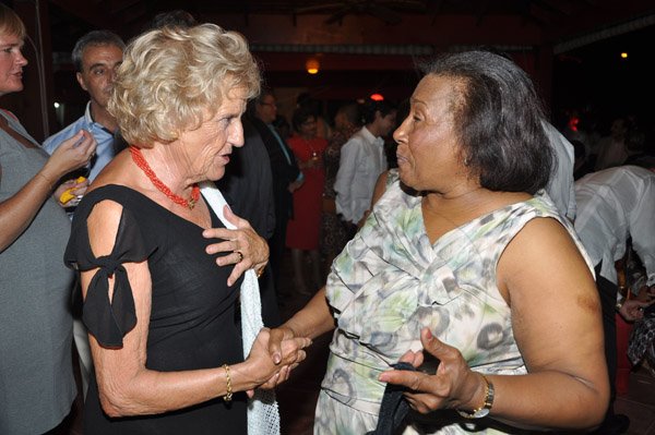 Jermaine Barnaby/Photographer
Filomena Ruiz (left) wife of Spanish ambassador talks about her country's National Day to former justice Minister, Dorothy Lightbourne at the Embassy Residence – I-B Norbrook Road on Thursday, October 9, 2014.