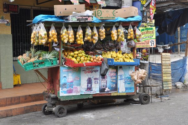 Jermaine Barnaby/Photographer
A handcart decorated with fruits along main street, St Ann's Bay during a tour of parish capital, St Ann's Bay on Saturday March 21, 2014.