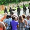 Norman Grindley/ChiefPhotographer
Family members and friends of Keith Clarke, gather on Kirkland Close during a Military operation in Sterling Castle in Upper St. Andrew May 27, 2010. Keith Clarke was killed in his home during the operation.