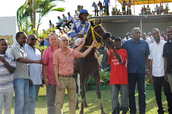 Ian Allen/Photographer
Handlers of Brawn in the Winners Enclosurer after winning the (8th) The Super Lotto "Become a Super Millionaire" Trophy on Boxing Day.