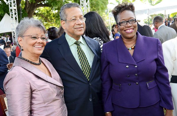 Rudolph Brown/Photographer
Director of Public Prosecutions Paula Llewellyn (right), pose with Deputy Prime Minister and Minister of Foreign Affairs and Foreign Trade, Dr Ken Baugh and his wife Vilma Baugh.


***************************************************************************************** at Andrew Holness swearing in as new Prime Minister at King's House on Sunday, October 23-2011