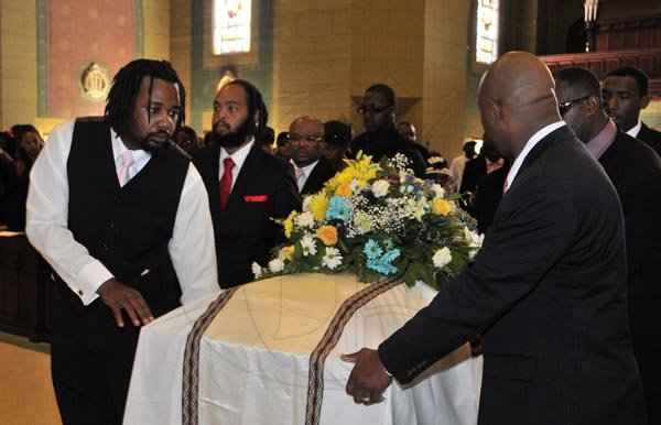 Gladstone Taylor  / Photographer

Pall  Bearers take the coffin into the holy trinity cathedral

Phillip Burrell (first left), Kareem Burrell (second left), Earl Thompson (third left), Brandon Burrell (fourth left), Micheal Burrell (first right), Bally Cummings (second right), Kasheik Burrell (third right)

Thanksgiving Service for the life of Philip "Fattis" Burrell held at the Holy Trinity Cathedral, 1-3 George Headley Drive, Kingston on Saturday December 17, 2011