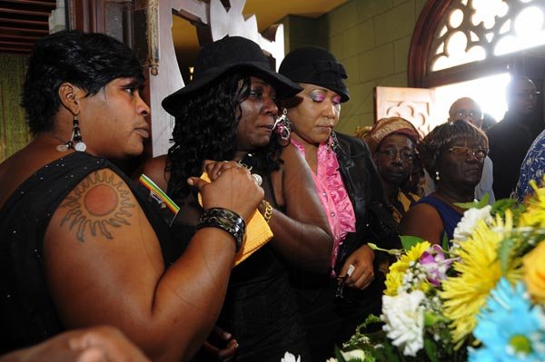 Gladstone Taylor  / Photographer

l-r Michelle Sinclair, Carmelita Burrell (wife), Huvine Ferguson, and Flo O'Connor

Thanksgiving Service for the life of Philip "Fattis" Burrell held at the Holy Trinity Cathedral, 1-3 George Headley Drive, Kingston on Saturday December 17, 2011