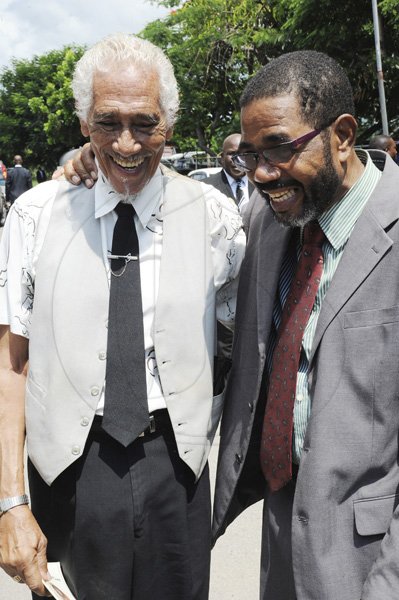 Norman Grindley/Chief Photographer
Rretired veteran crime fighter Senior Superintendent of Police (SSP) Hector 'Bingie' (right) White, greet veteran photographer Junior Dowie, at the thanksgiving service for the life of retired SSP Anthony 'Tony' Hewitt, held at the Boulevard Baptist Church in St Andrew yesterday.