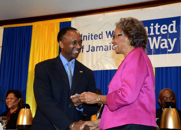 Winston Sill/Freelance Photographer
United Way of Jamaica annual Nation Builders'  Awards and  Employee Awards Ceremony, Held at the Jamaica Pegasus Hotel, New Kingston on Thursday September 11, 2014. Here are Wayne Wray (left); and Lady Rheima Hall (right).